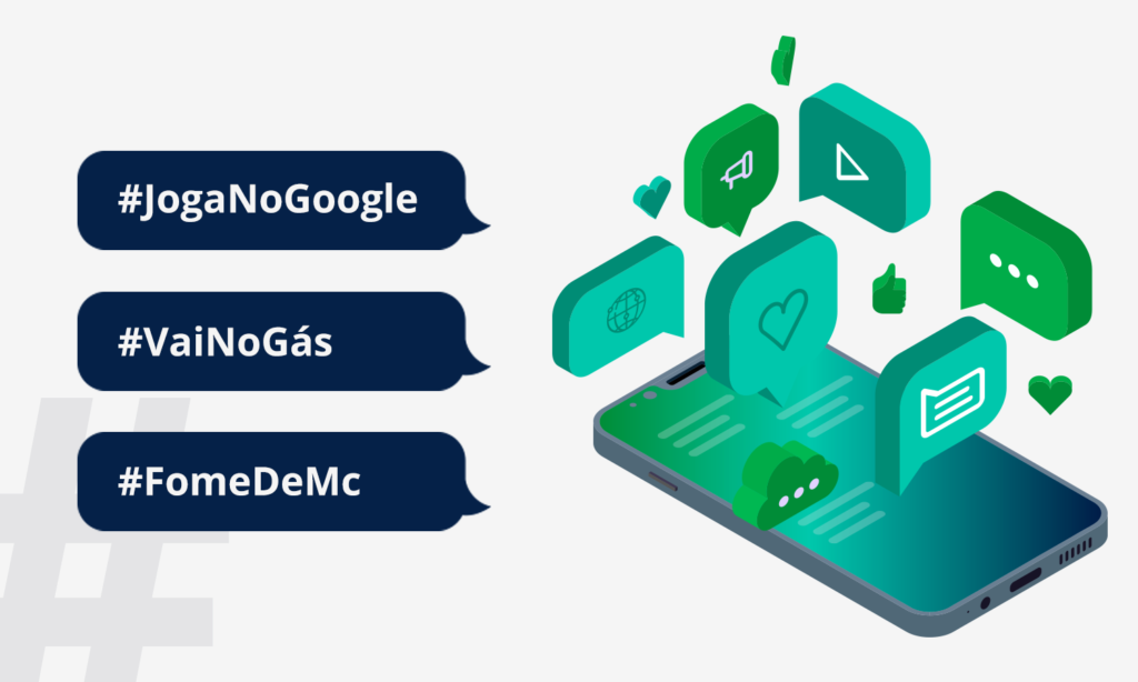 HashtagS. Em um fundo brando do lado esquerdo em balões azuis e letras brancas temos as seguintes hashtags: #joganogoogle, #vainogás e #fomedemc. Do lado direito temos um um celular com a representação de algumas interações das redes sociais. 